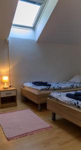 En eller flere senge i et værelse på Apartment Nuška