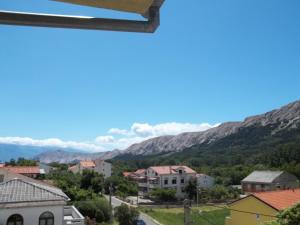 a view of the mountains from a house at Lovrić Apartments in Baška +70 photos