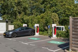 a car parked in a parking lot with two pay phones at ibis Senlis in Senlis