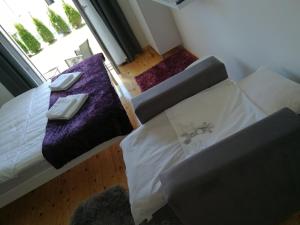 Ένα ή περισσότερα κρεβάτια σε δωμάτιο στο Apartman Ena