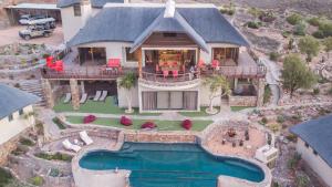 an aerial view of a house with a swimming pool at White Lion Lodge on Sanbona in Montagu