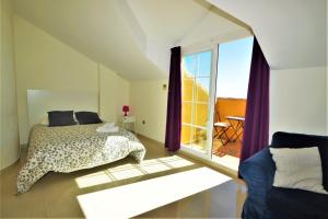 Posteľ alebo postele v izbe v ubytovaní Excepcional Duplex al lado de la playa y con vistas al mar