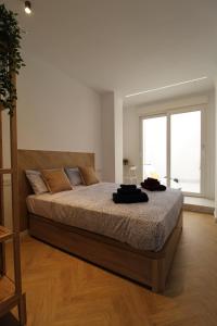 A bed or beds in a room at Encanto en el centro de Alicante