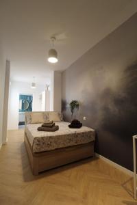 A bed or beds in a room at Encanto en el centro de Alicante