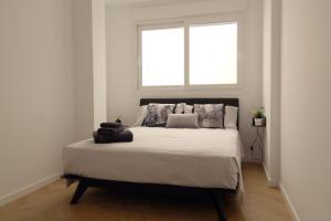 A bed or beds in a room at Encanto en el centro de Alicante