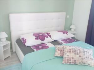 a bedroom with two beds and two pillows at Ana Rooms in Krk