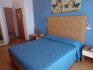 Postel nebo postele na pokoji v ubytování Hotel Lory My Wellness SPA