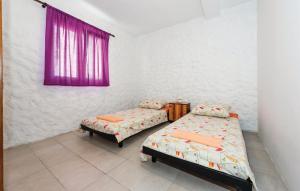 Giường trong phòng chung tại Holiday Home Hacienda Bilice