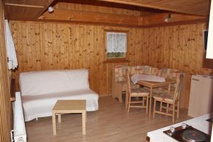 a room with a bed and a table and chairs at Ferienhaus am Zainhammer in Brotterode