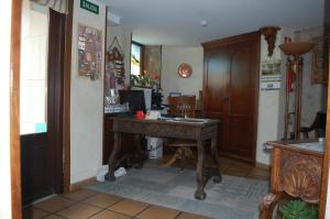 a room with a wooden desk in a room at HOTEL RURAL EL DENARIO in Garray