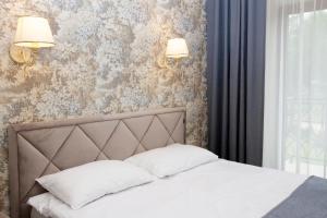 Un pat sau paturi într-o cameră la Villa Airina