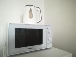 TV a/nebo společenská místnost v ubytování Da Rinota in Alta Val di Non