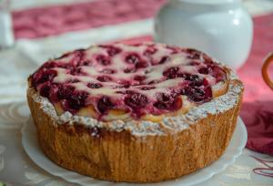 a blueberry pie on a plate on a table at Suzdal Spasskaya Gorka in Suzdal