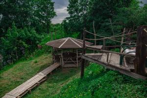 a wooden bridge in the middle of a field at Suzdal Spasskaya Gorka in Suzdal