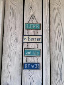 Ein Zertifikat, Auszeichnung, Logo oder anderes Dokument, das in der Unterkunft BUQEZ Villa 30 "Beachvilla Stella" mit SPA & Meerblick ausgestellt ist