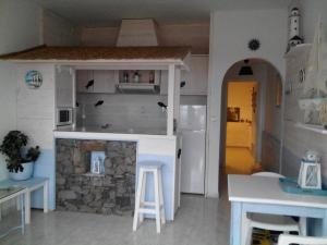a doll house with a kitchen and a bar at Paradis in Morro del Jable