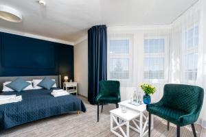 Postel nebo postele na pokoji v ubytování JACHTOWA Hotel i Restauracja + 59 fotografií