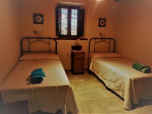 Postel nebo postele na pokoji v ubytování Cortijo Don Enrique + 37 fotografií