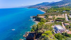 an aerial view of a house on a cliff next to the ocean at Casa Bianca Rais Gerbi in Finale