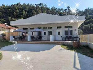 a house with a pool in front of it at Villa Remetzo in Skala Potamias