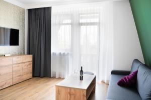 Televízia a/alebo spoločenská miestnosť v ubytovaní Apartamenty, Boutique Rooms Villa 82, MIEJSCE PRKINGOWE