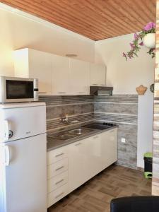 Køkken eller tekøkken på Villa Bilogora & Apartments