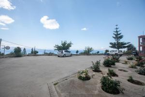 a parking lot with two cars parked in it at eleni studios in Vlachata