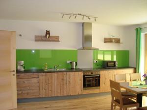 A kitchen or kitchenette at Haus Alexander