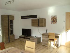 A television and/or entertainment centre at Haus Alexander