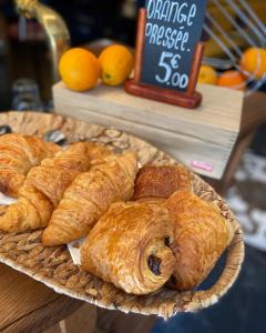 a plate of croissants and other pastries on a table at Hotel Relais Du Postillon in Antibes