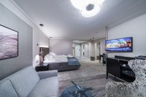TV a/nebo společenská místnost v ubytování Strandhotel Duhnen