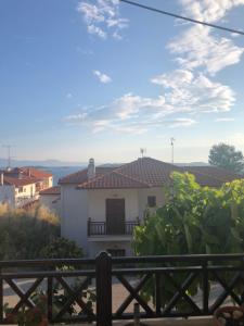 a view of a house from a balcony at Dione Apartments in Ouranoupoli