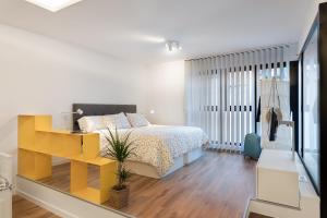 Postel nebo postele na pokoji v ubytování Suite Nest
