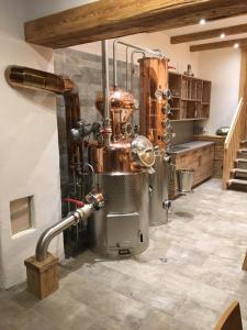 a kitchen with a large machine in a room at Bauernhof Hinterfirst in Söll