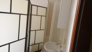 a bathroom with a white sink and a mirror at Hotel Gambara in Milan