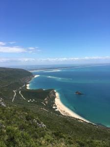 an aerial view of a beach in the ocean at Casa do Farol da Arrábida in Portinho da Arrábida