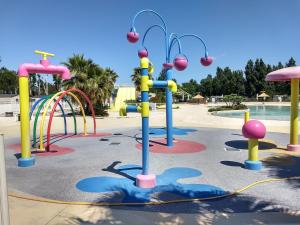 a playground with a water park at VIAS Plage La Carabasse - Mobile home 6 places in Vias