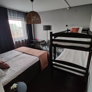 Postel nebo postele na pokoji v ubytování CarlstadCity H Boutique Hotell