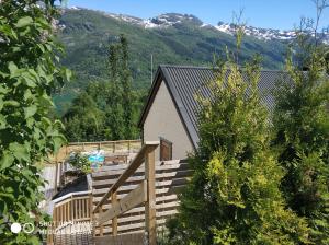 a staircase leading to a house with mountains in the background at Summer haus in Syreflot +5 photos