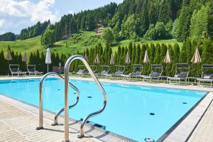 Bazén v ubytování Hotel Happy Filzmoos nebo v jeho okolí