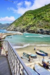 a view of a beach with boats on the sand at Da Marcella in Vernazza