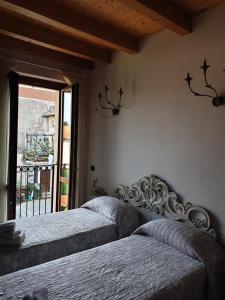 Postel nebo postele na pokoji v ubytování B&B Il Rustico
