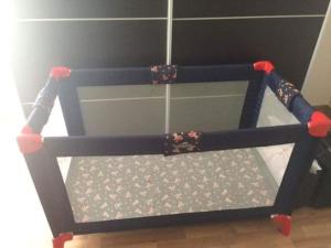 a childs toy crib with wheels on the floor at 66 Peniche in Peniche