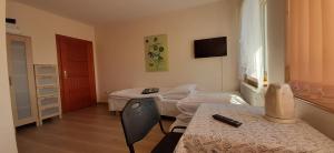 Łóżko lub łóżka w pokoju w obiekcie Słoneczny Dom pokoje i apartament na wynajem