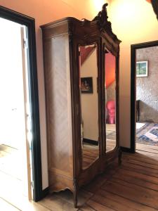 a mirror sitting on the floor in a room at Manoir de la Foulquetiere in Luçay-le-Mâle