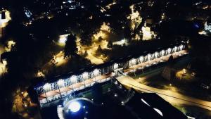 an overhead view of a building with lights at night at Café Feldmann & Pension in Bad Sooden-Allendorf