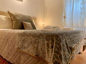 A bed or beds in a room at La Casa Di Ago