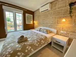 Giường trong phòng chung tại Apartments Villa Mike