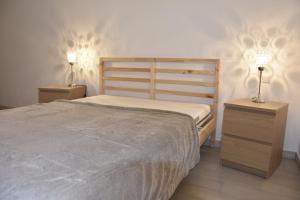Postel nebo postele na pokoji v ubytování La petite maison gîte Mettet