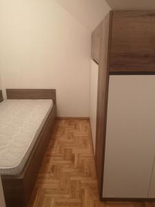 Postel nebo postele na pokoji v ubytování Apartman Milić Zlatibor + 15 fotografií